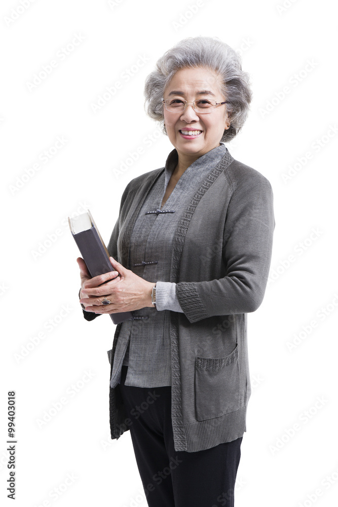 Happy senior woman with book