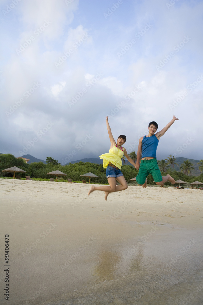 Young couple having fun at the beach