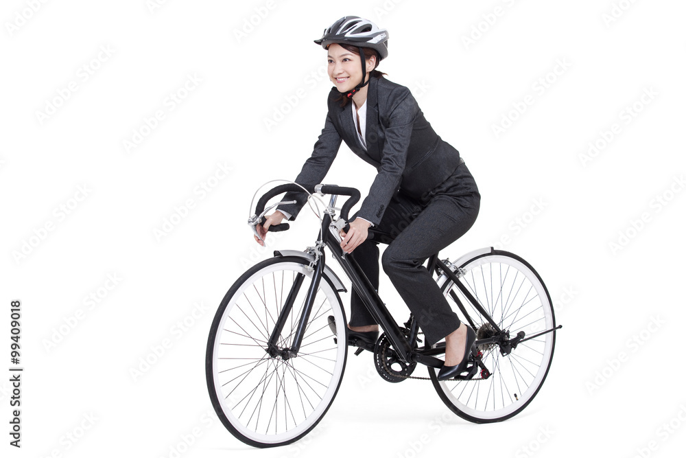 Young businesswoman on a bike