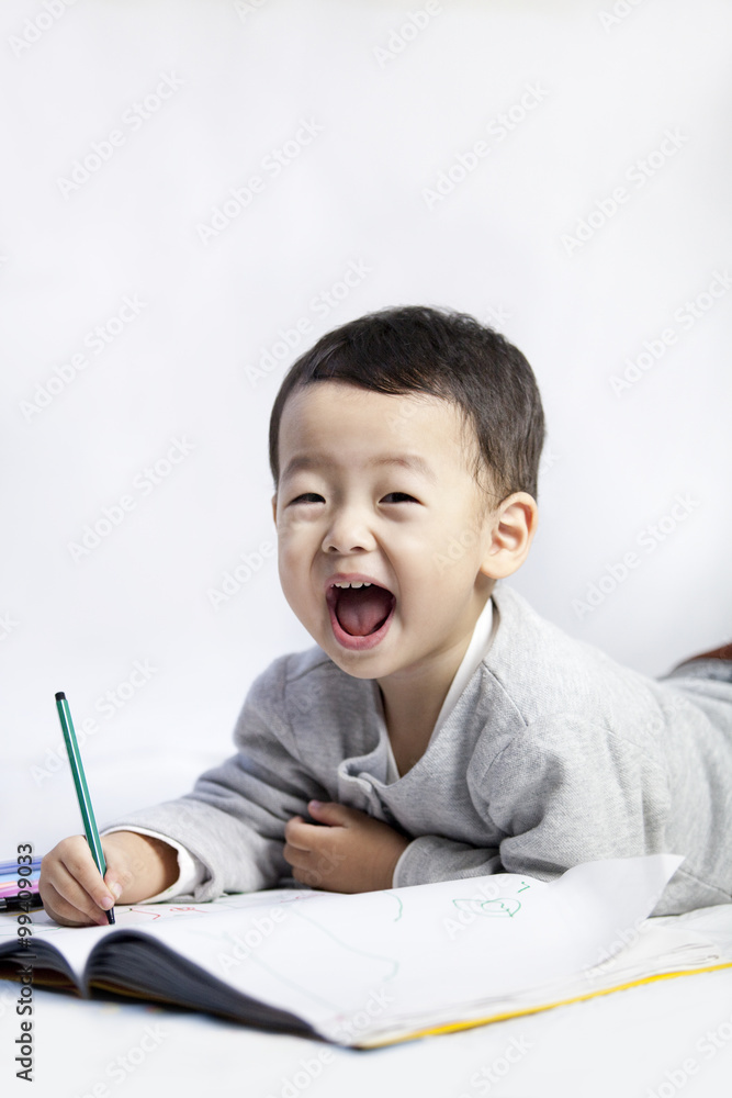 Excited boy writing and cheering