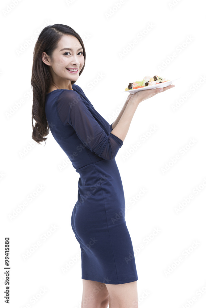 Happy young woman serving food