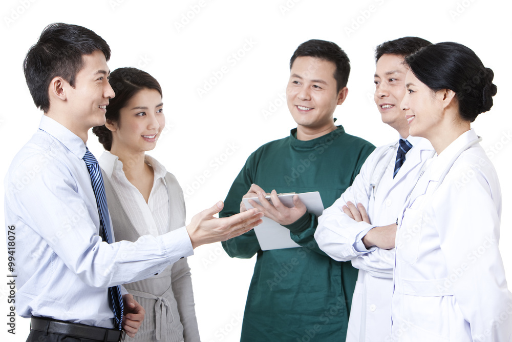 Cheerful young couple with medical team