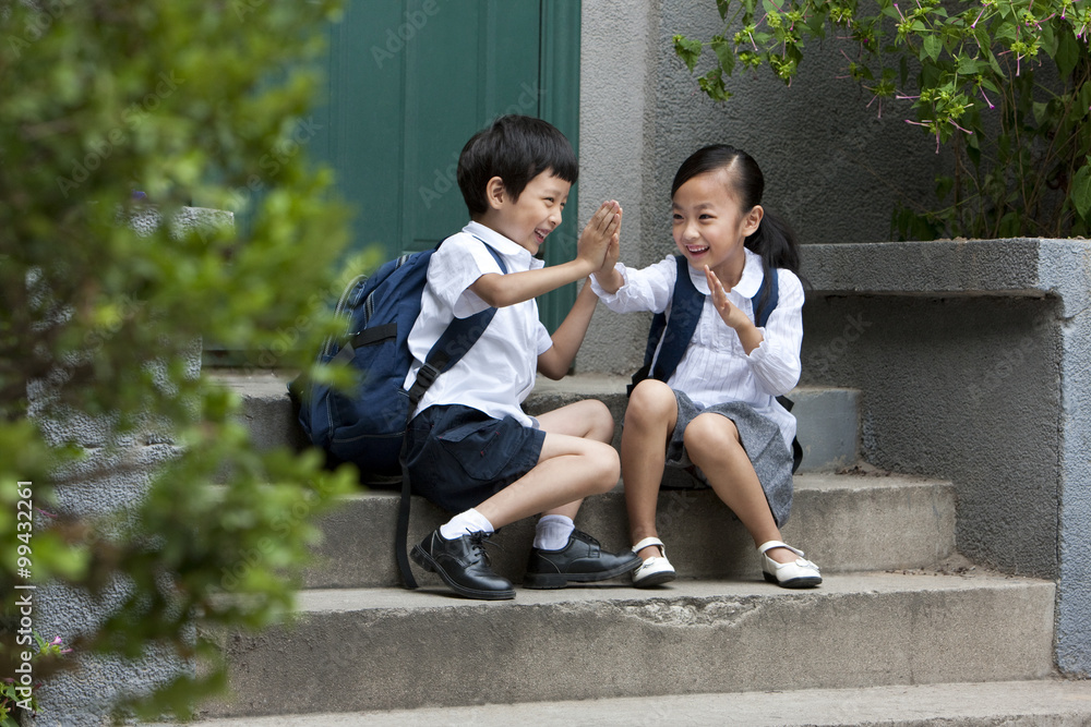 Two school children playing outside