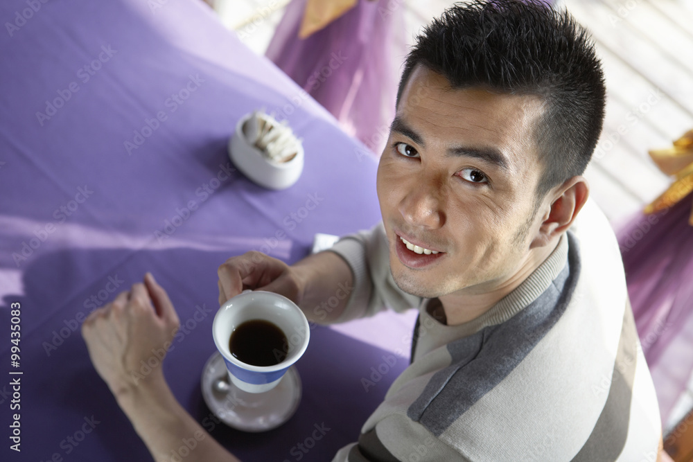 Man Drinking A Cup Of Coffee