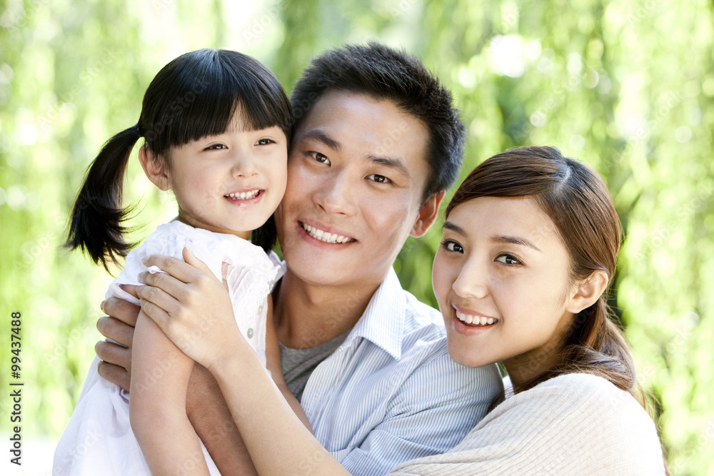 Young Chinese family in a park