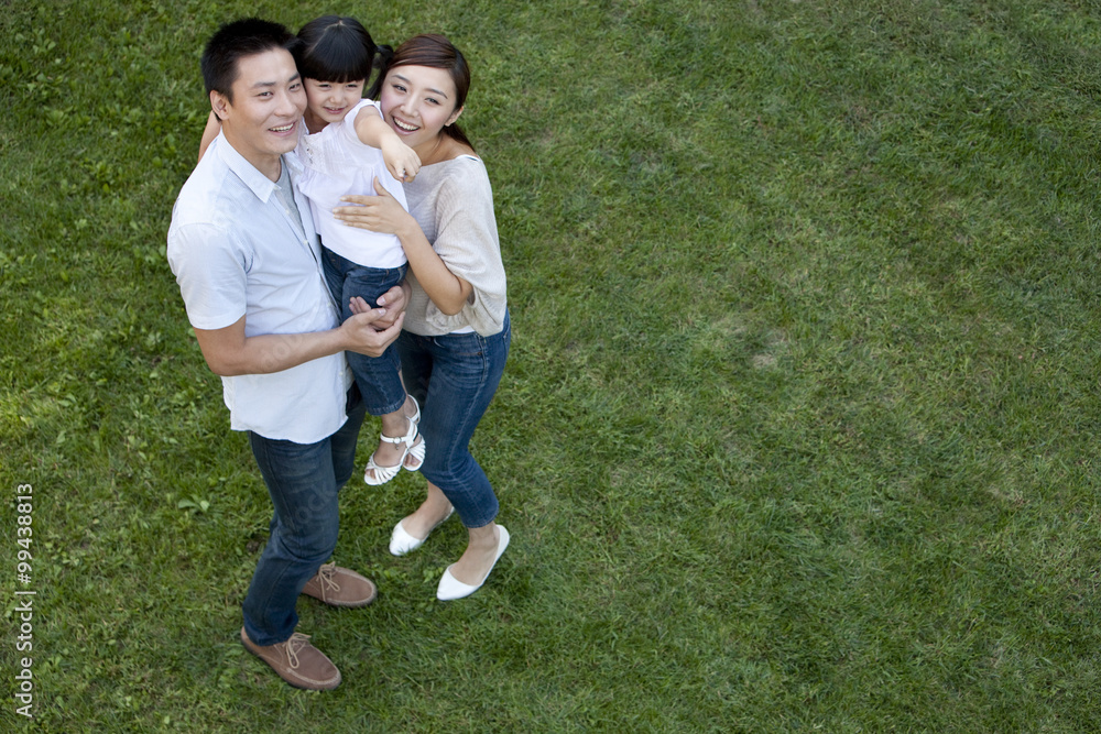 Young Chinese family in a park