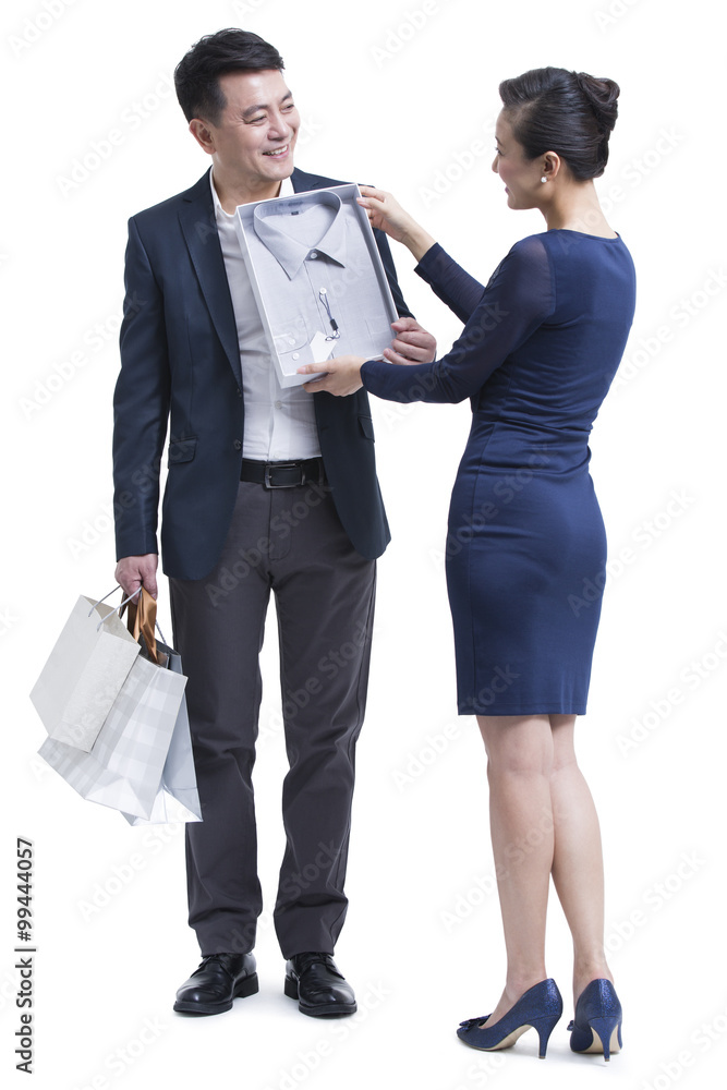 Cheerful mature couple shopping