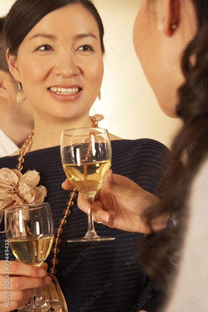 Two Women Drinking Wine And Chatting