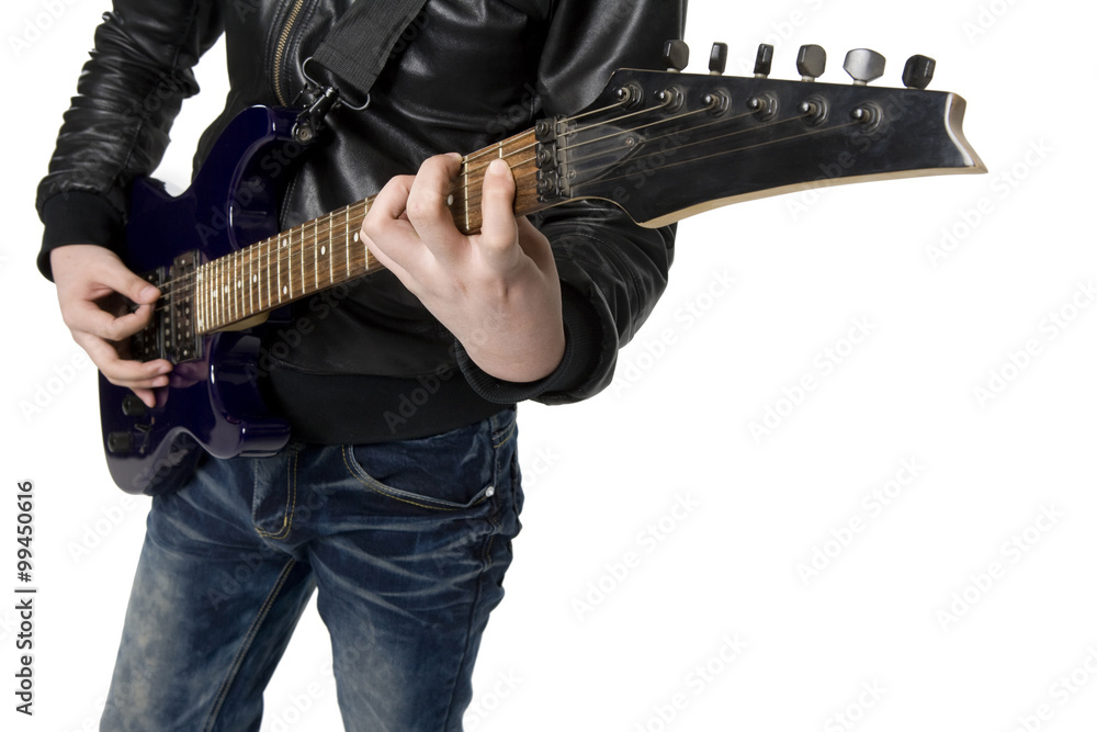 Young man playing an electric guitar