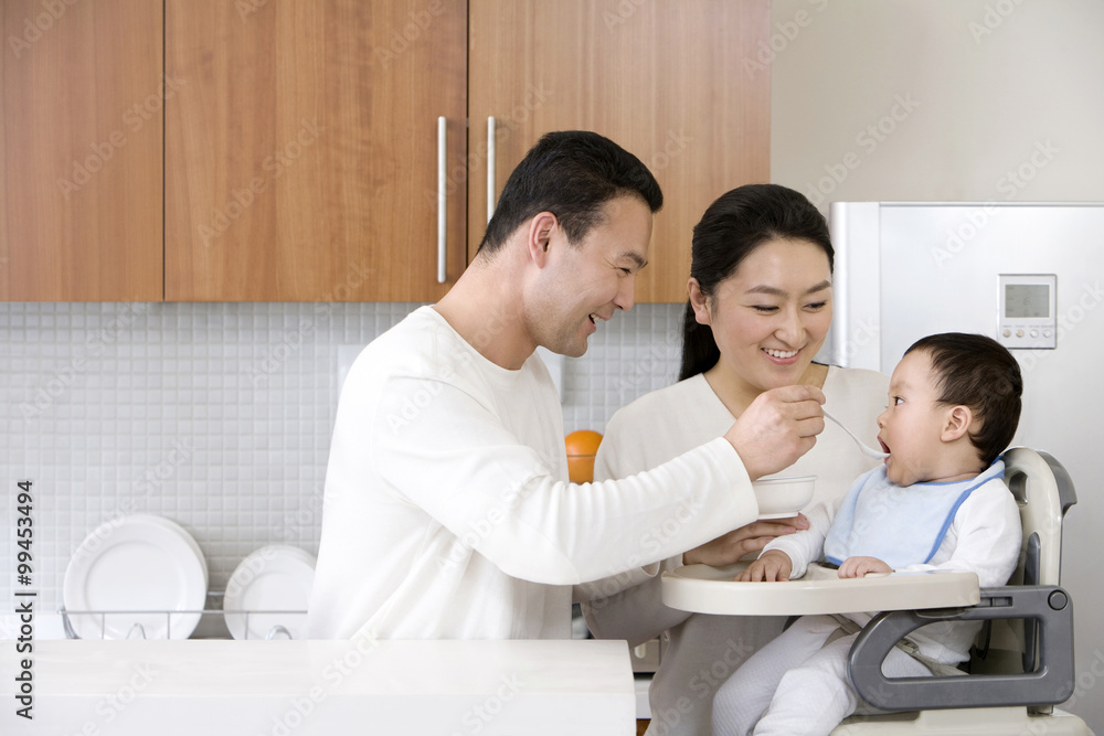 Family feeding child