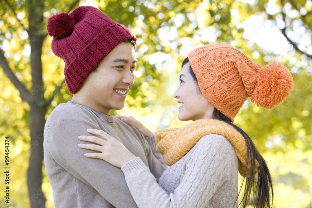 Young Couple in a Park in Autumn