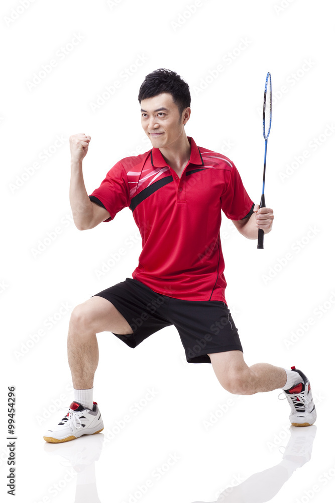 Male badminton player celebrating with excitement