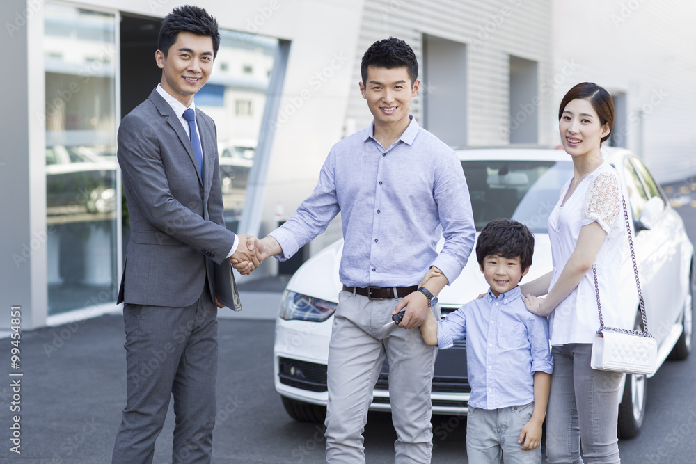 Young family buying car