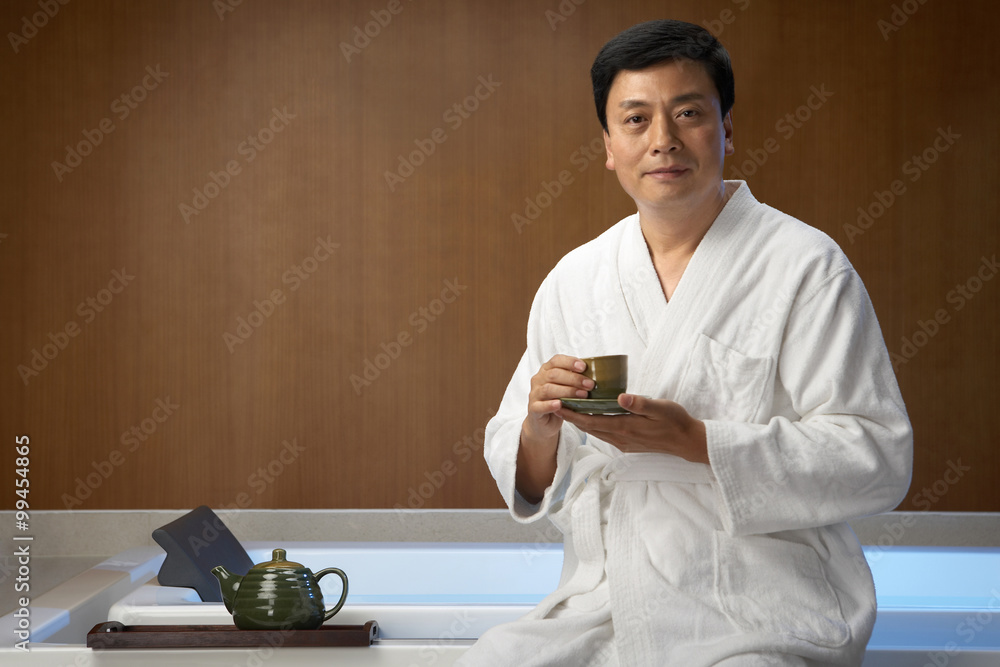 Man drinking tea at a spa