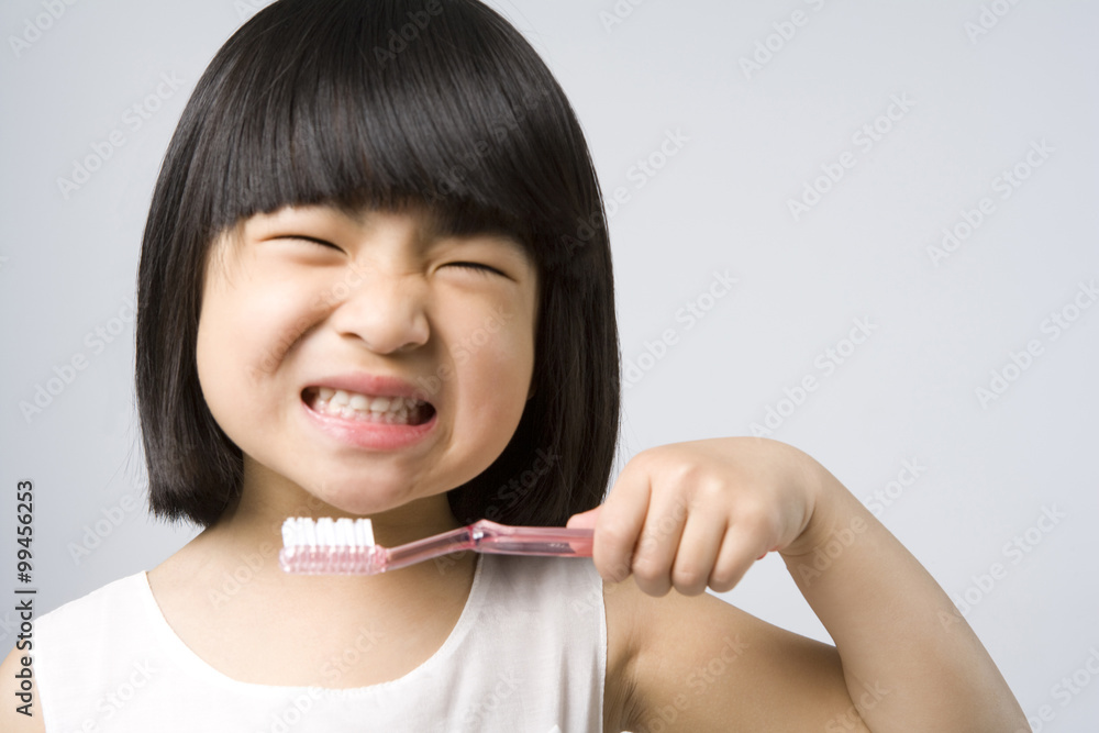 Little girl brushing teeth