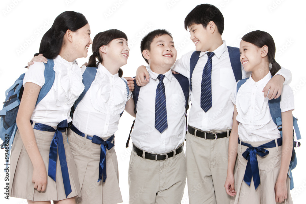 Cheerful primary school friends enjoying being around each other