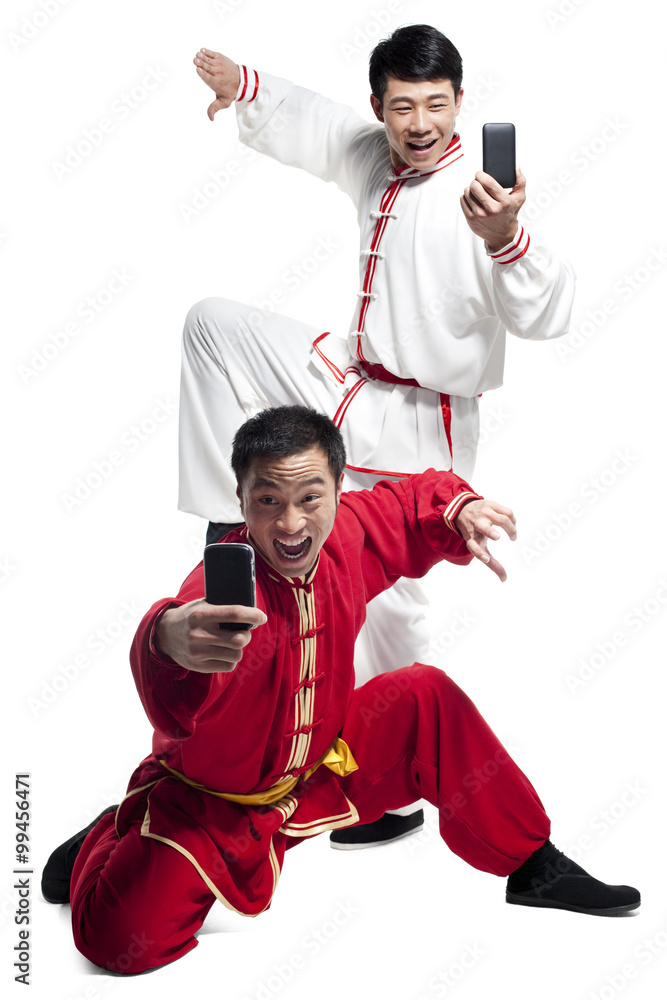 Men Doing Martial Arts and Looking at Mobile Phone