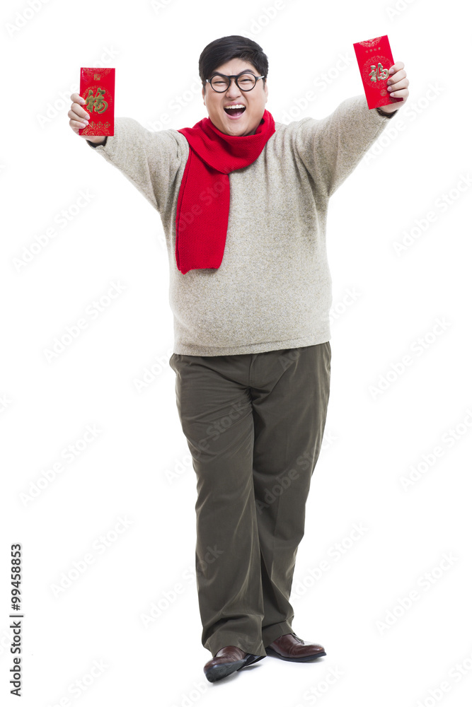 Chubby young man with red packets celebrating Chinese New Year