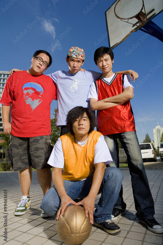 Teenage Boys Posing On A Basketball Court