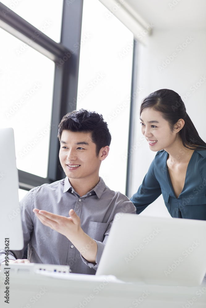 Young business person talking in office