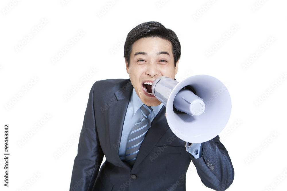 Portrait of a businessman shouting into a megaphone