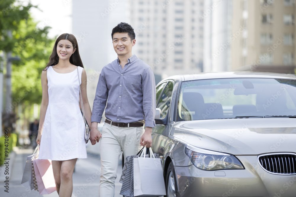 Happy young couple shopping