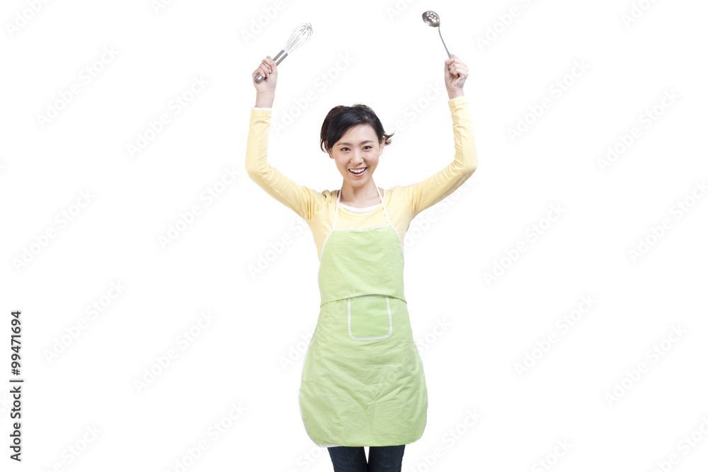 Happy housewife and cooking utensils