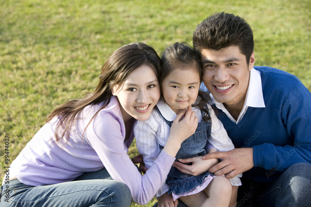 Portrait of young family at the park