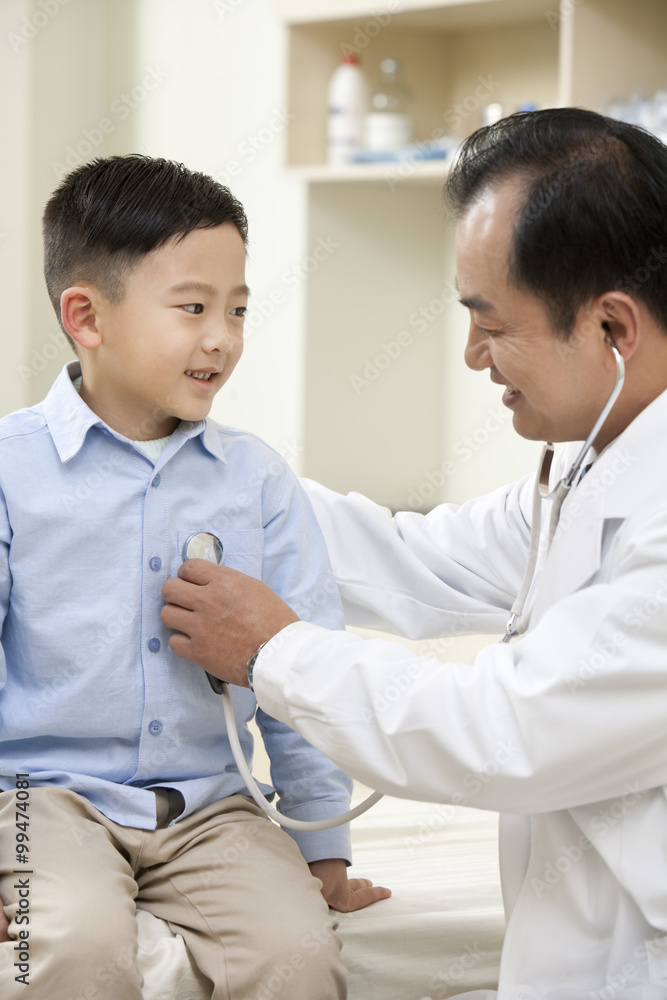 Young Boy is Examined by a Doctor