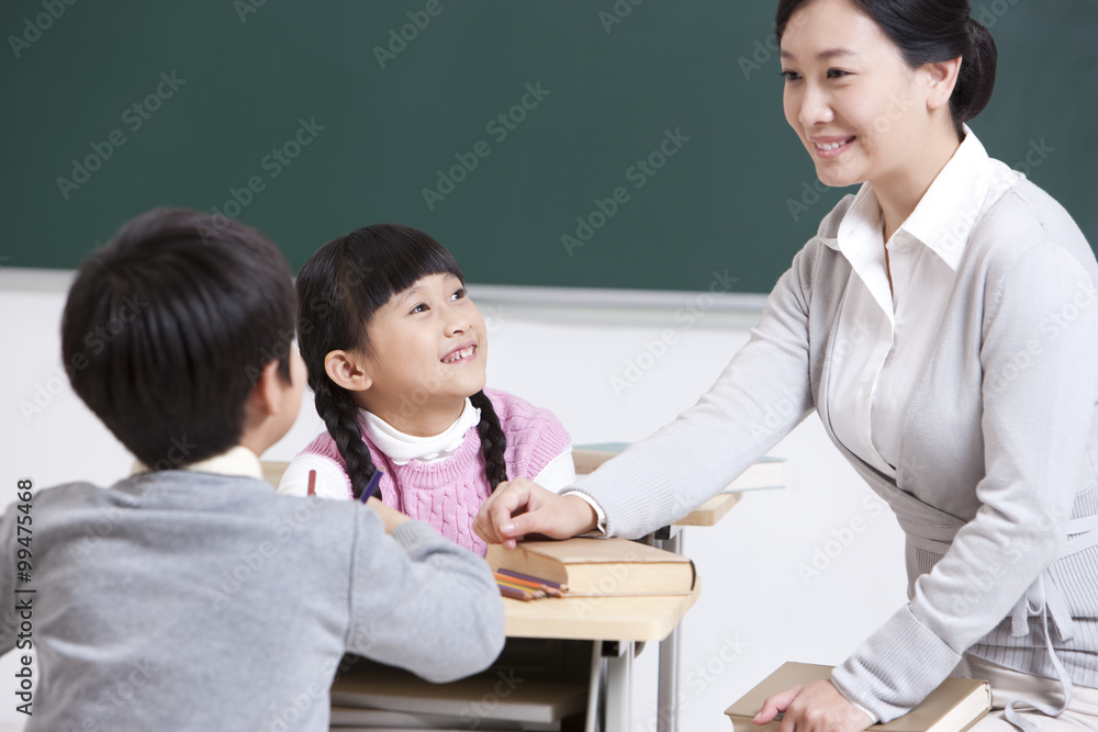 Happy schoolchildren in classroom