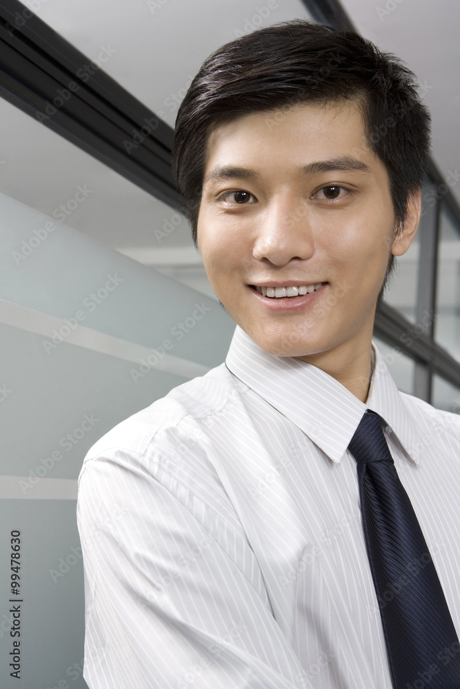 Portrait of young businessman in office