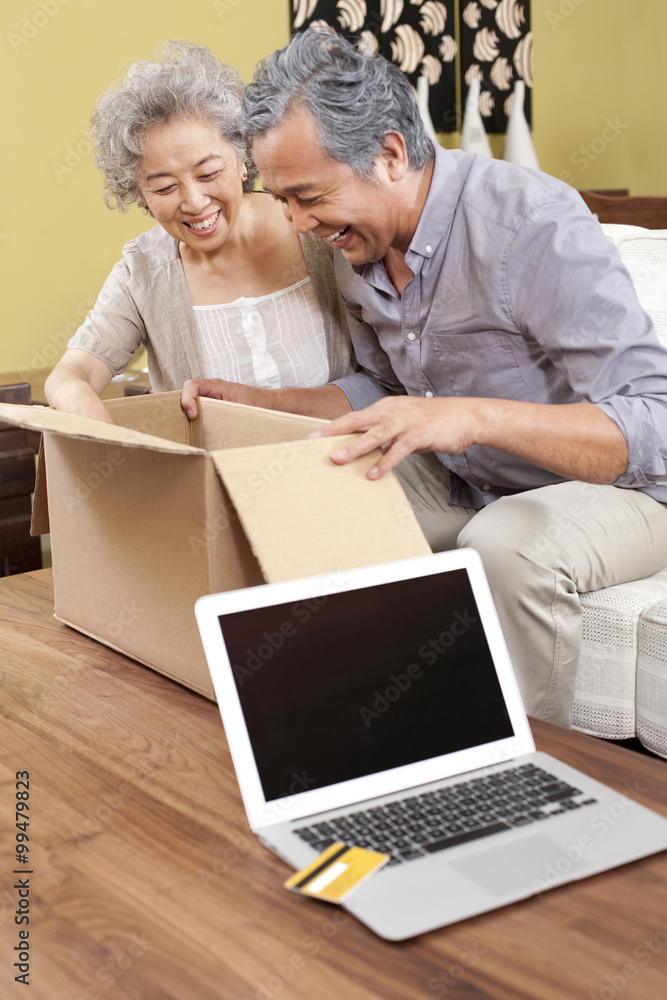 Senior couple receiving their online purchase