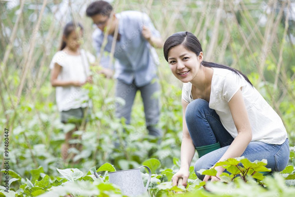 Young family gardening together