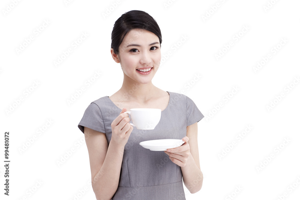 Young businesswoman drinking coffee