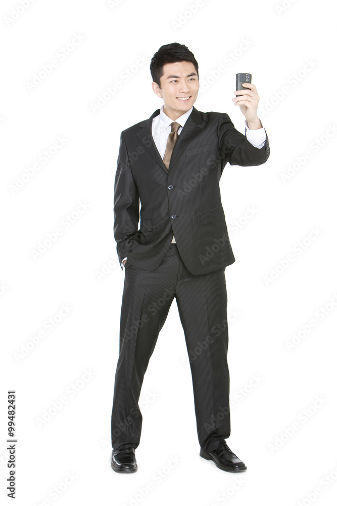 Young businessman using mobile phone