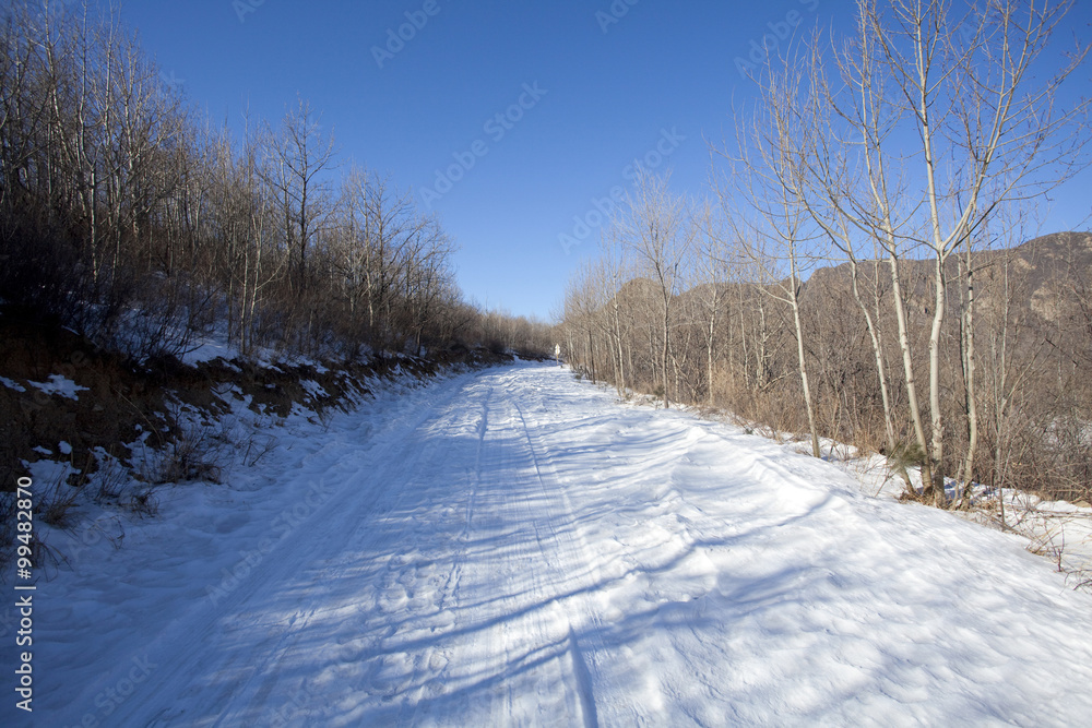 Snow-covered road going forward, Beijing China