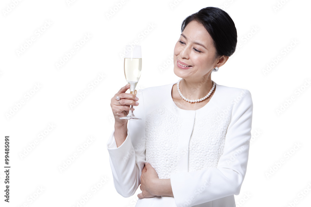 Elegant mature woman drinking champagne