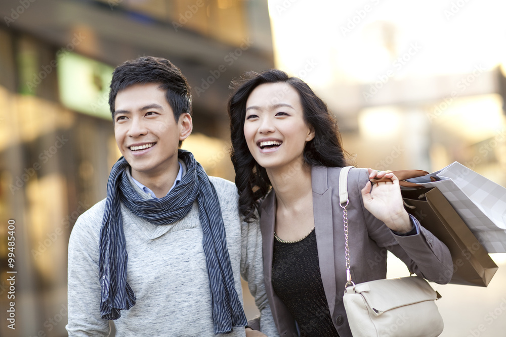 Fashionable young couple shopping