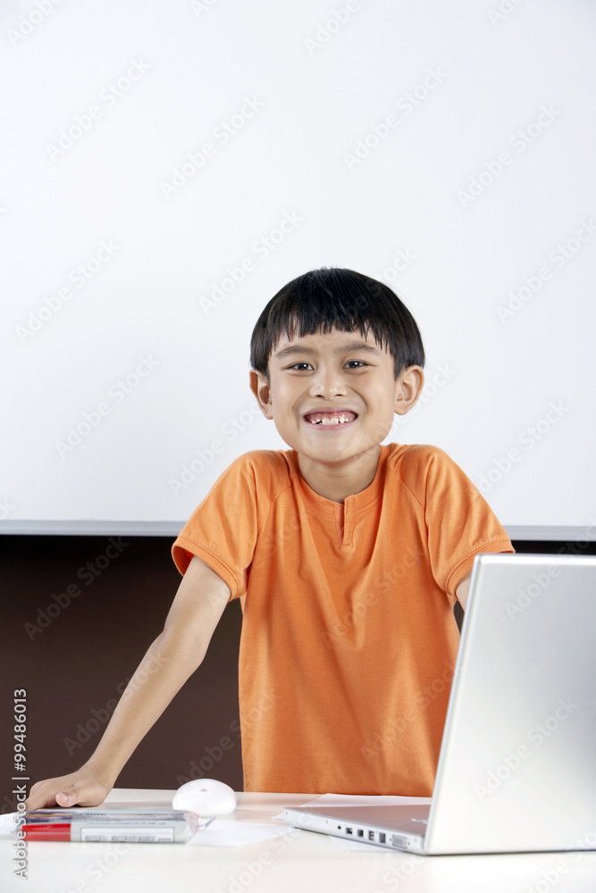 Young Boy Using Laptop Computer