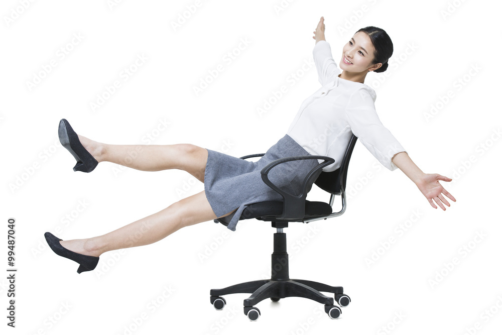 Young businesswoman stretching on chair