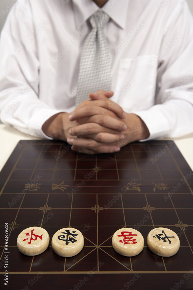 Office worker playing Chinese chess