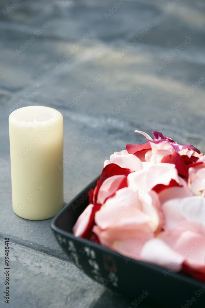 Tranquil Scene Of Flower Petals And A Candle