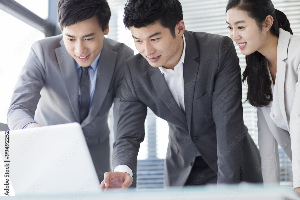 Young business person talking in meeting room