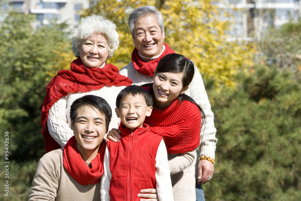 Three Generation Family Enjoying a Park in Autumn