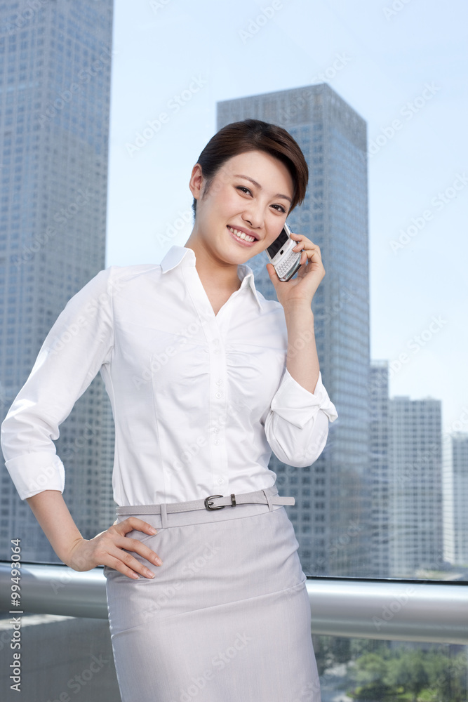 Businesswoman using mobile phone