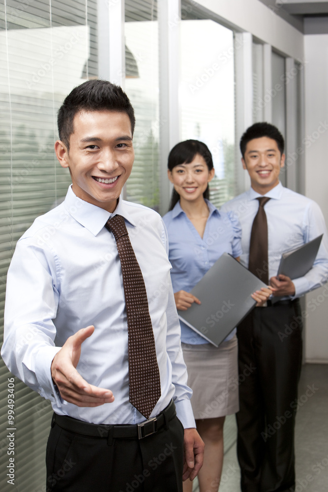 Businessman Holding Out Hand For A Handshake