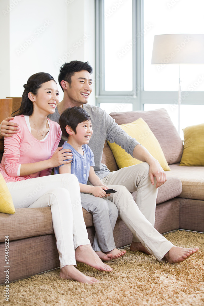 Happy family watching TV