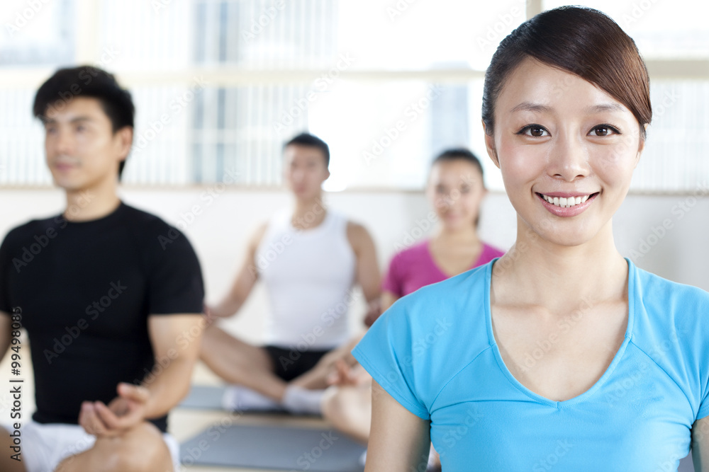 Profile of a Young Woman in a Yoga Class