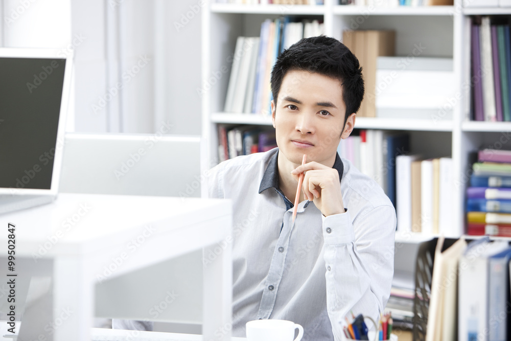 Young businessman working in the office