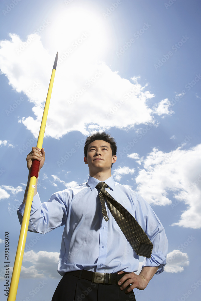 Businessman Throwing A Javelin